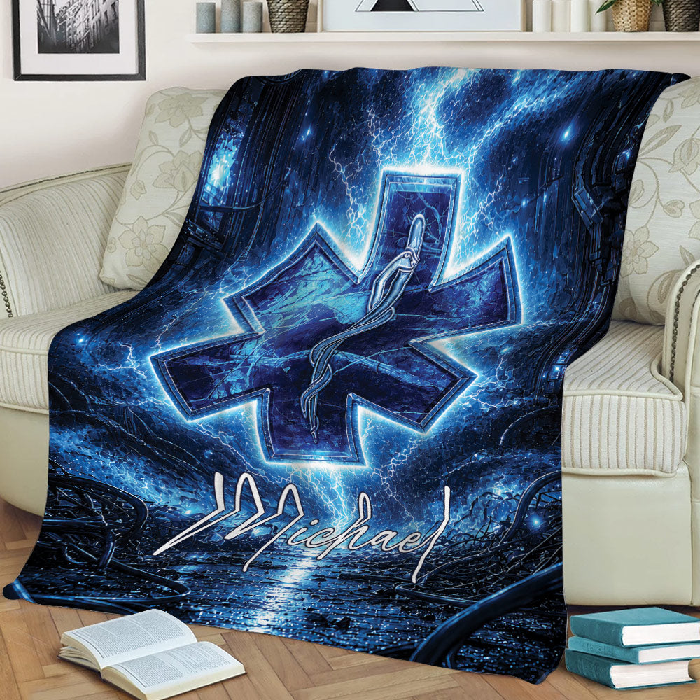 Paramedic throw blanket styled on a couch with blue lightning, caduceus, and Star of Life design