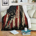 Lacrosse blanket displayed on a sofa with vintage sports artwork and a lacrosse stick
