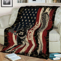 Lacrosse throw blanket draped over a chair with player artwork and bold red, black, and cream tones