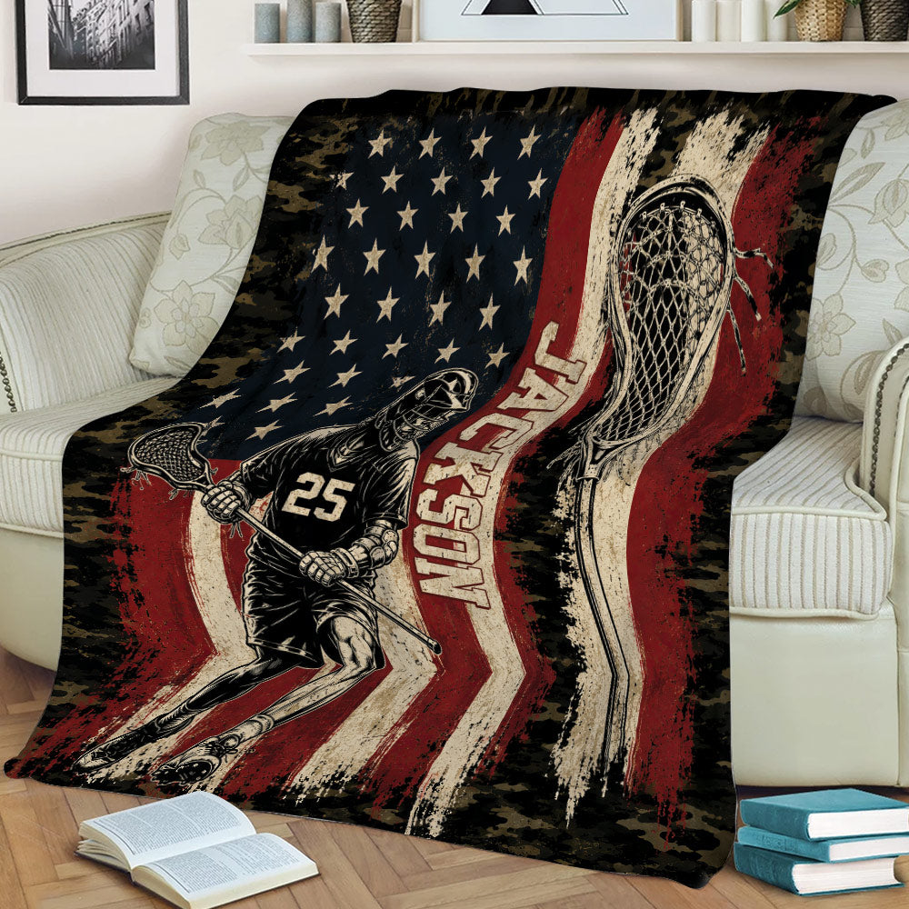 Lacrosse throw blanket draped over a chair with player artwork and bold red, black, and cream tones