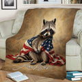 Raccoon blanket displayed on a couch with wildlife artwork and a red, white, and blue flag