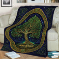 Celtic-inspired Tree of Life blanket draped across a sofa, featuring leafy branches, roots, and ornate border details