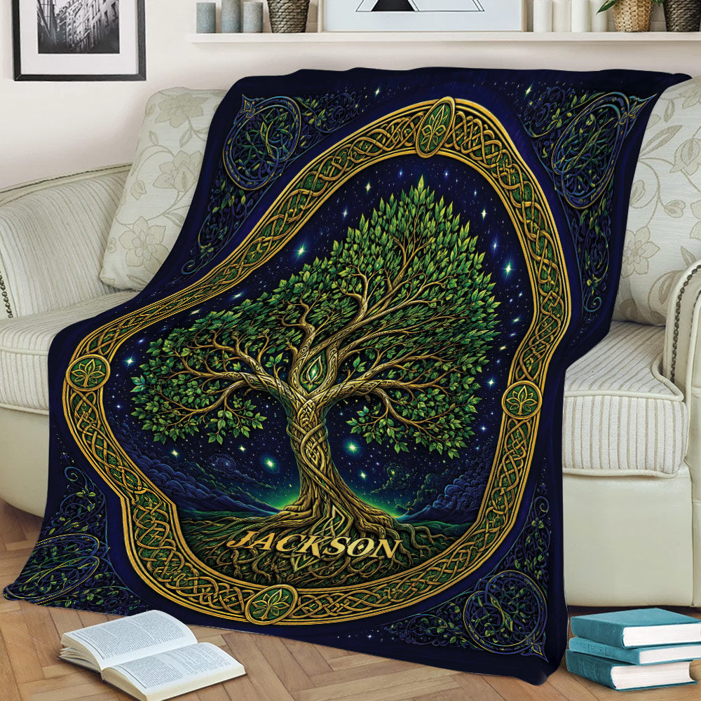 Celtic-inspired Tree of Life blanket draped across a sofa, featuring leafy branches, roots, and ornate border details