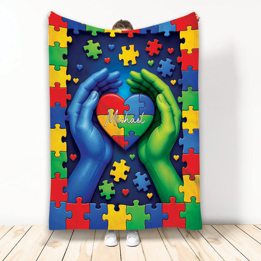 Autism throw blanket with colorful puzzle pieces, heart artwork, and supportive hands