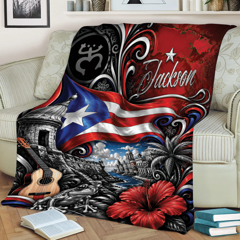 Puerto Rico throw blanket styled on a couch with flag imagery, coastal architecture, tropical flowers, guitar, and coquí frog