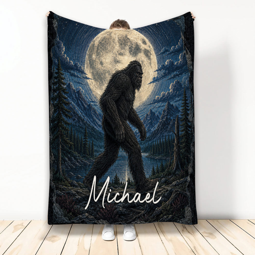 Bigfoot blanket with moonlit mountain, forest, lake and rugged wilderness artwork