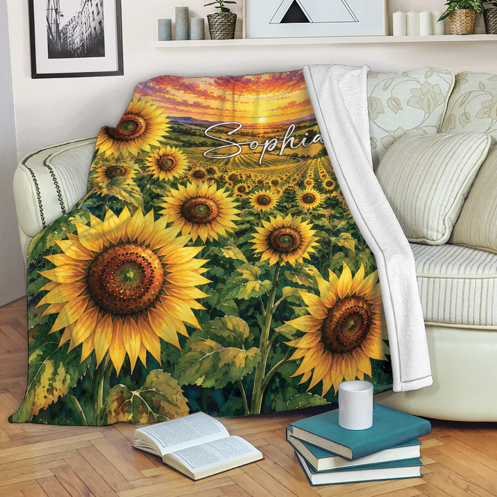 Sunflower blanket draped over a sofa with vibrant field and sunset artwork in a cozy living room