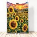 Sunflower throw blanket with colorful sunset field artwork displayed in a full-length lifestyle setting