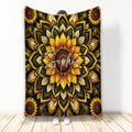 Sunflower throw blanket with bold golden floral mandala artwork and deep green botanical leaves