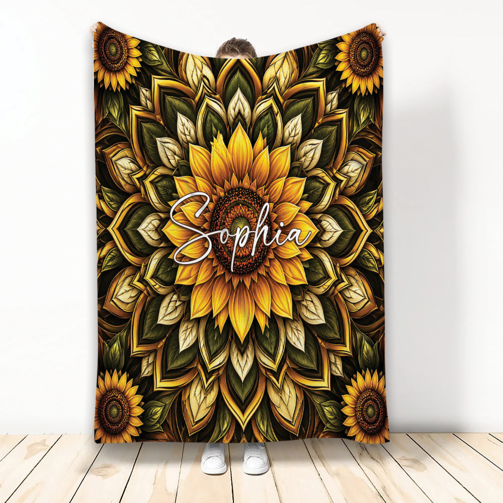 Sunflower throw blanket with bold golden floral mandala artwork and deep green botanical leaves
