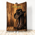Custom cowboy blanket featuring a western hat, leather boots, rope, and rustic wood artwork