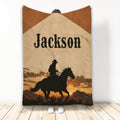 Cowboy throw blanket featuring a horseback rider silhouette, sunset mountains, and Western artwork