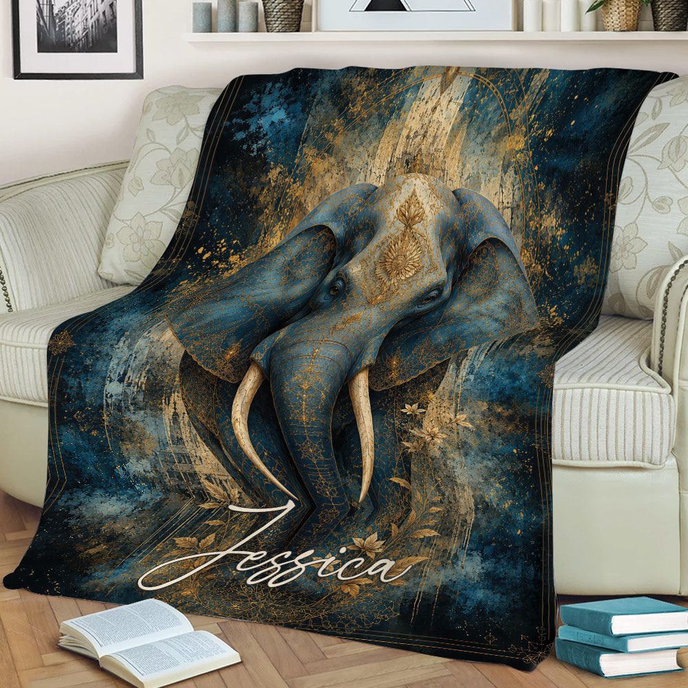 Decorative elephant blanket draped across a sofa with blue and gold artwork