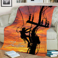 Lineman throw blanket displayed on a couch with power lines, utility worker silhouette, and sunset artwork
