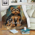Yorkshire Terrier throw blanket displayed on a sofa with black and tan Yorkie artwork and cozy living room styling