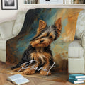 Yorkshire Terrier blanket draped over a sofa, featuring expressive Yorkie artwork in black, tan, blue and bronze