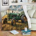Green tractor blanket draped over a sofa in a cozy living room with books