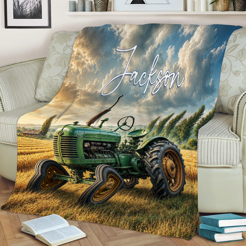 Rustic tractor throw blanket styled on a sofa with golden fields and countryside artwork