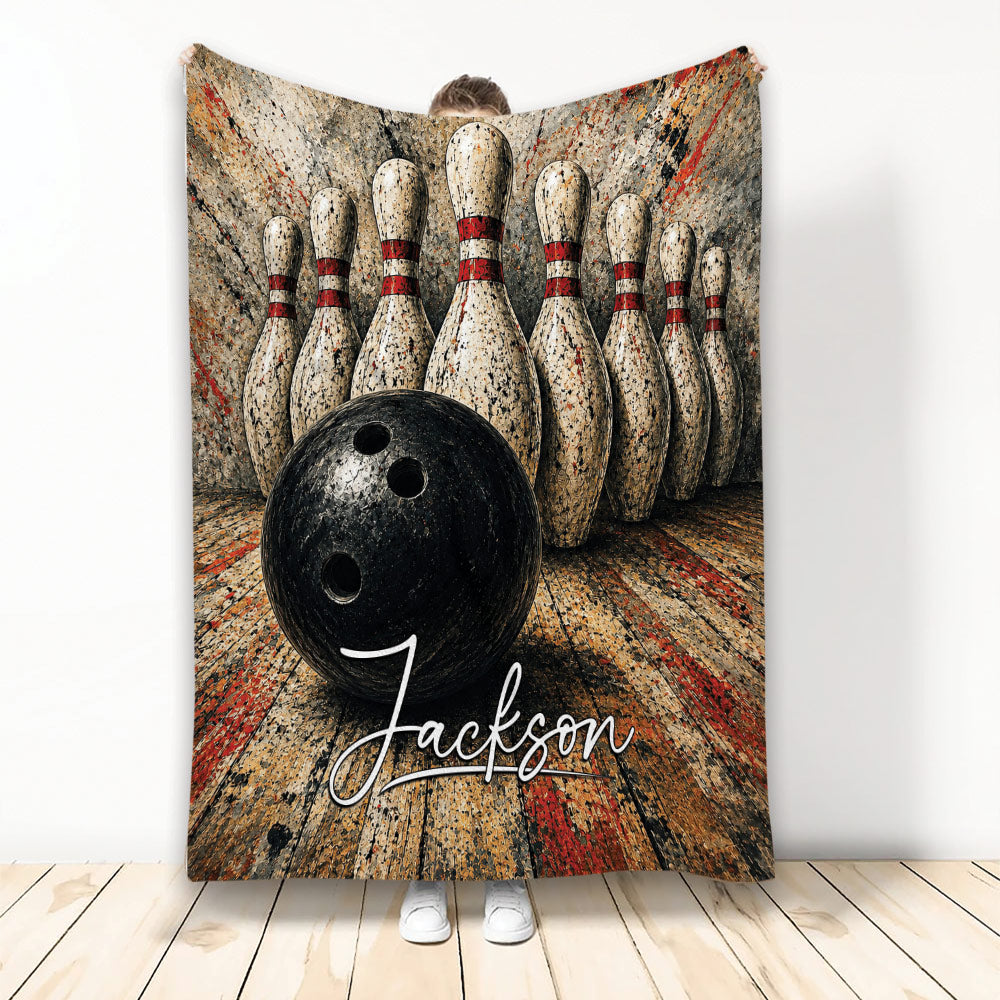 Bowling blanket featuring a black bowling ball, arranged pins, and bold distressed alley artwork