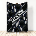 Bowling throw blanket with black bowling balls, white pins, and bold diagonal sports artwork
