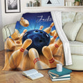 Bowling throw blanket draped over a sofa with blue ball and colorful pin artwork