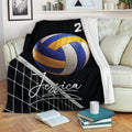 Volleyball blanket draped over a sofa with colorful ball and net artwork