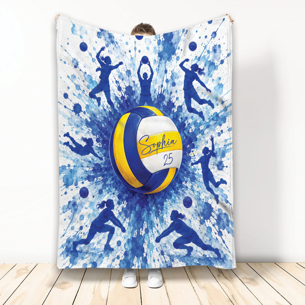 Blue and yellow volleyball blanket featuring dynamic player silhouettes and watercolor sports artwork