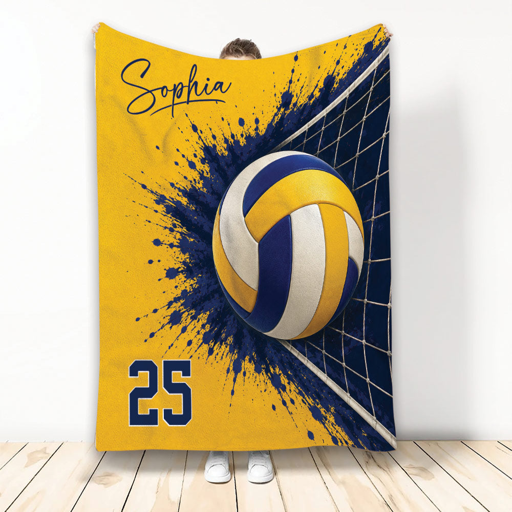 Yellow and navy volleyball throw blanket featuring a volleyball, net, and energetic paint-splash design