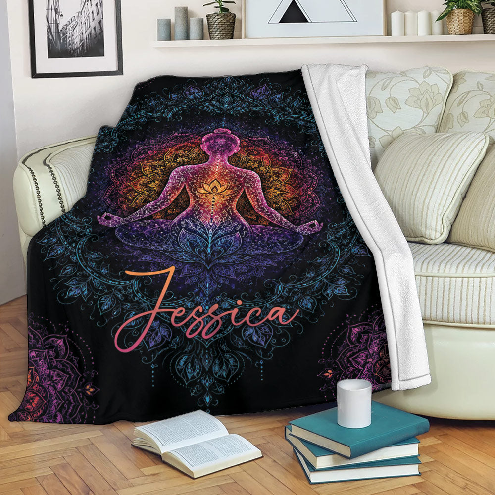 Yoga meditation mandala throw blanket draped over a cozy sofa