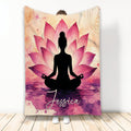 Yoga throw blanket featuring a seated meditation silhouette surrounded by pink lotus flowers and watercolor artwork