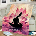Meditation throw blanket draped over a sofa with a yoga silhouette and vibrant pink lotus flower design