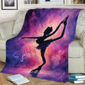 Figure skater ice skating blanket draped over a sofa with purple watercolor galaxy artwork