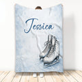 Custom ice skating throw blanket with illustrated white skates on a snowy blue winter background