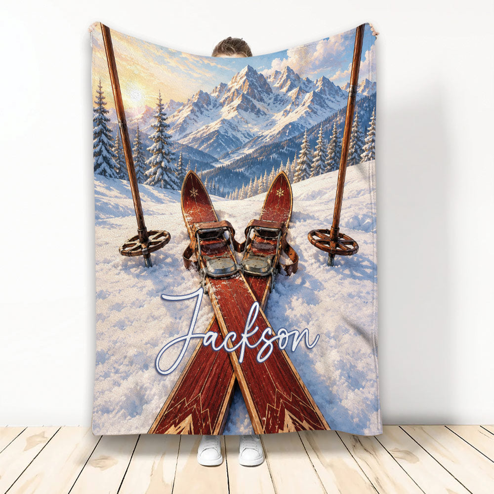 Skiing throw blanket with vintage skis, poles, snowy alpine mountains, and winter artwork