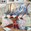 Skiing throw blanket draped over a couch with alpine mountain and ski artwork