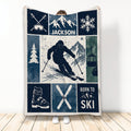 Custom skiing blanket with skier, crossed skis, snowy mountains, ski boots, goggles, and snowflake artwork