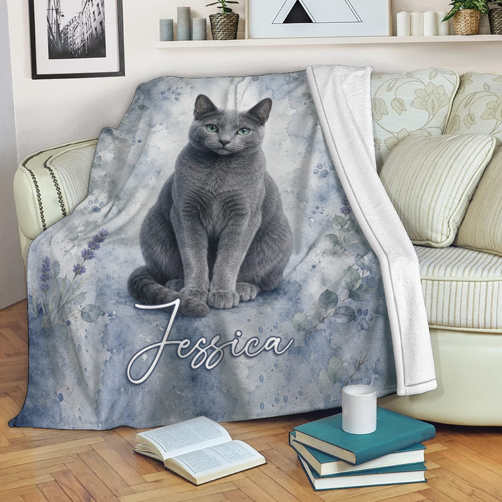 Russian Blue cat blanket draped over a sofa with soft blue botanical watercolor design
