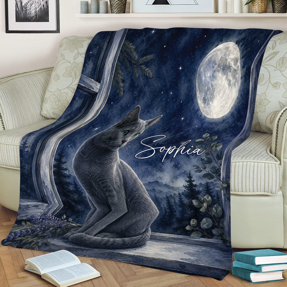 Russian Blue cat blanket draped over a sofa, featuring a full moon, stars, mountains, and greenery