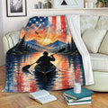 Kayak throw blanket draped over a sofa with mountain lake and patriotic watercolor artwork