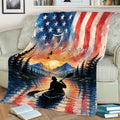 Kayak throw blanket displayed on a couch with sunset mountains, forest and reflective water
