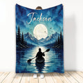 Kayak throw blanket with a moonlit mountain lake, pine trees, blue watercolor scenery, and paddler artwork