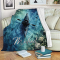 Kayak throw blanket displayed on a sofa with blue water artwork, fish, and a paddler
