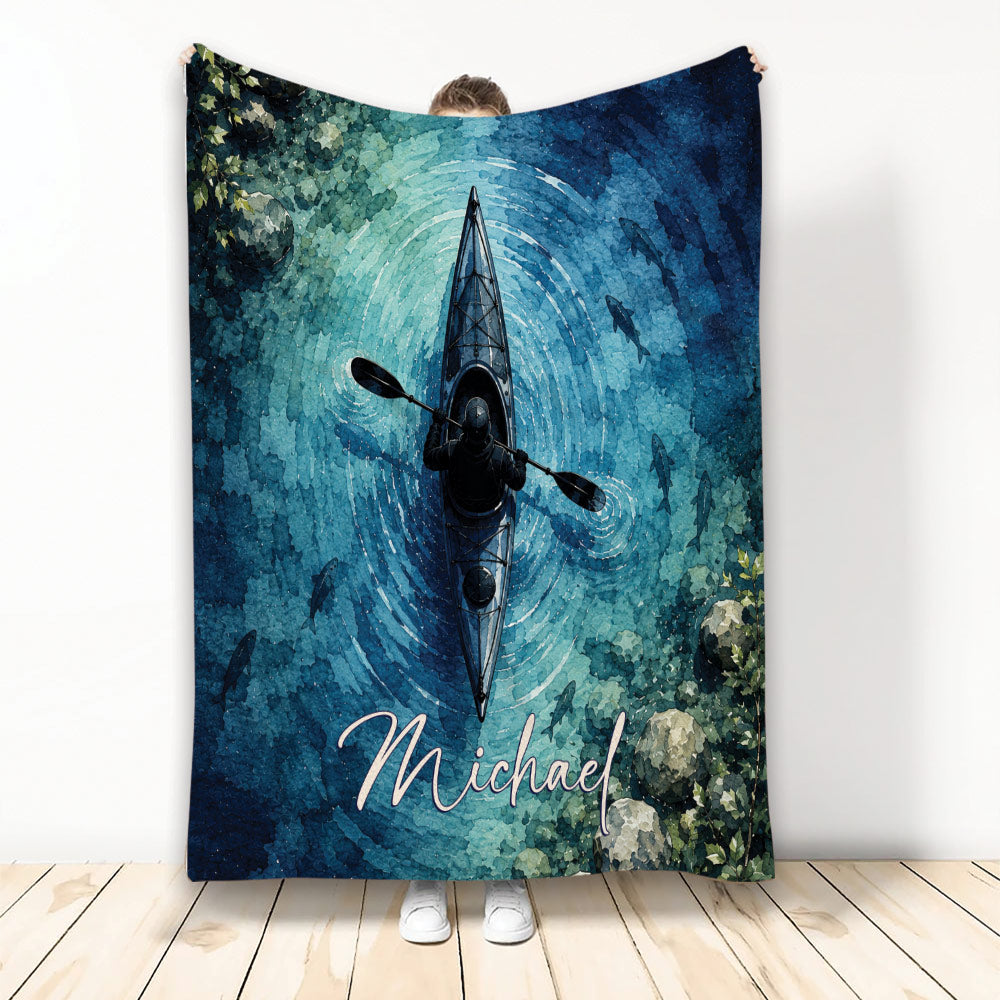 Watercolor kayak blanket featuring a paddler on blue water with fish and forest-inspired artwork