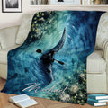 Kayak blanket draped over a sofa, showing a watercolor paddler, rippling water, and fish