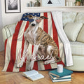Patriotic Whippet throw blanket displayed on a sofa with American flag artwork and red, white, and blue accents
