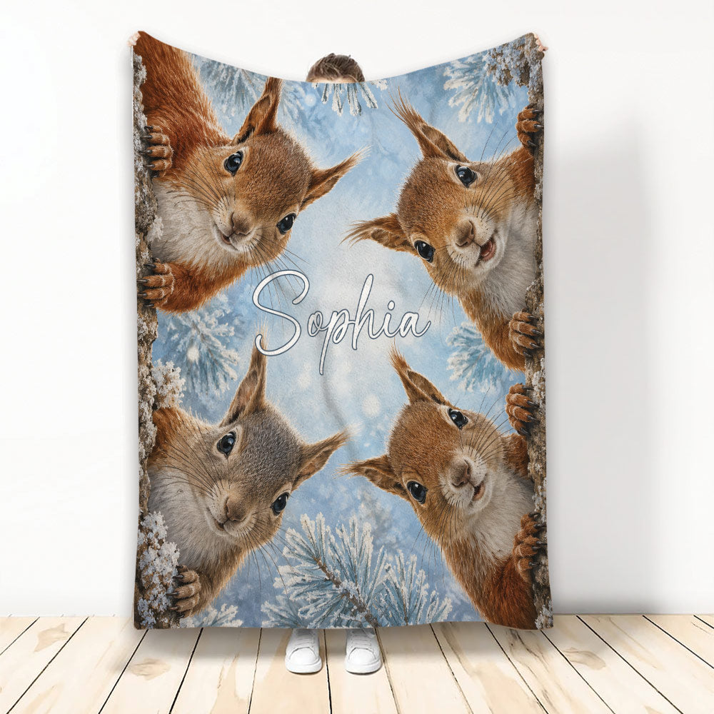 Squirrel throw blanket with four playful woodland squirrels against a snowy blue winter scene