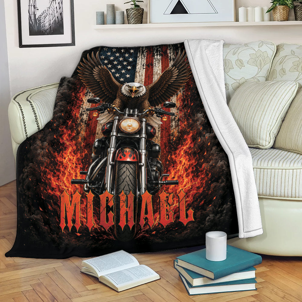 Motorcycle biker blanket draped over a couch with eagle, American flag, smoke and fiery red artwork