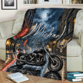 Motorcycle throw blanket draped over a sofa with rainy city streets and moonlit artwork