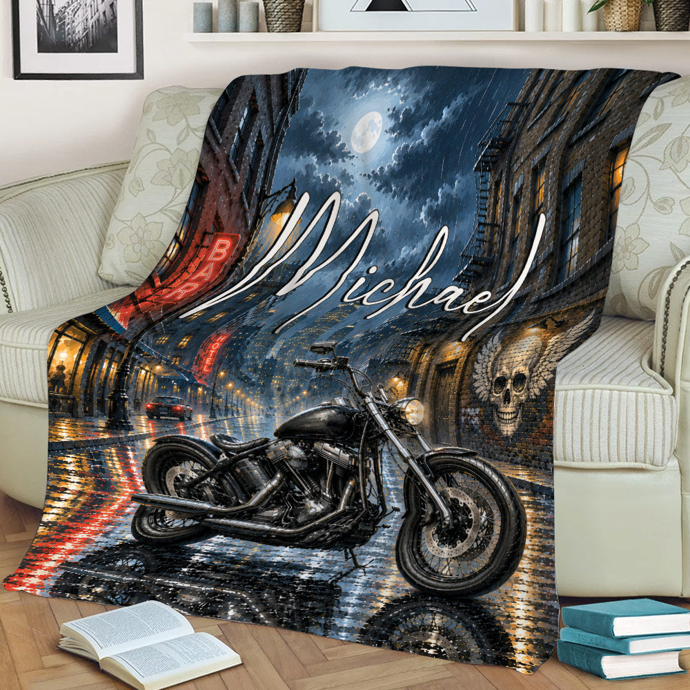 Motorcycle throw blanket draped over a sofa with rainy city streets and moonlit artwork