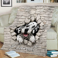 Dalmatian dog breaking through a brick wall on a cozy living room blanket